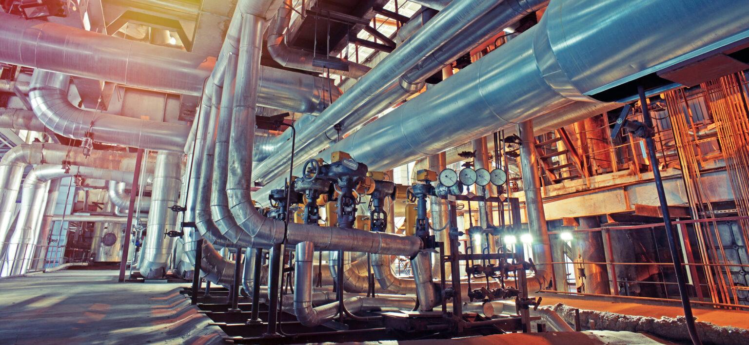 Equipment, cables and piping as found inside of a modern industr Image description